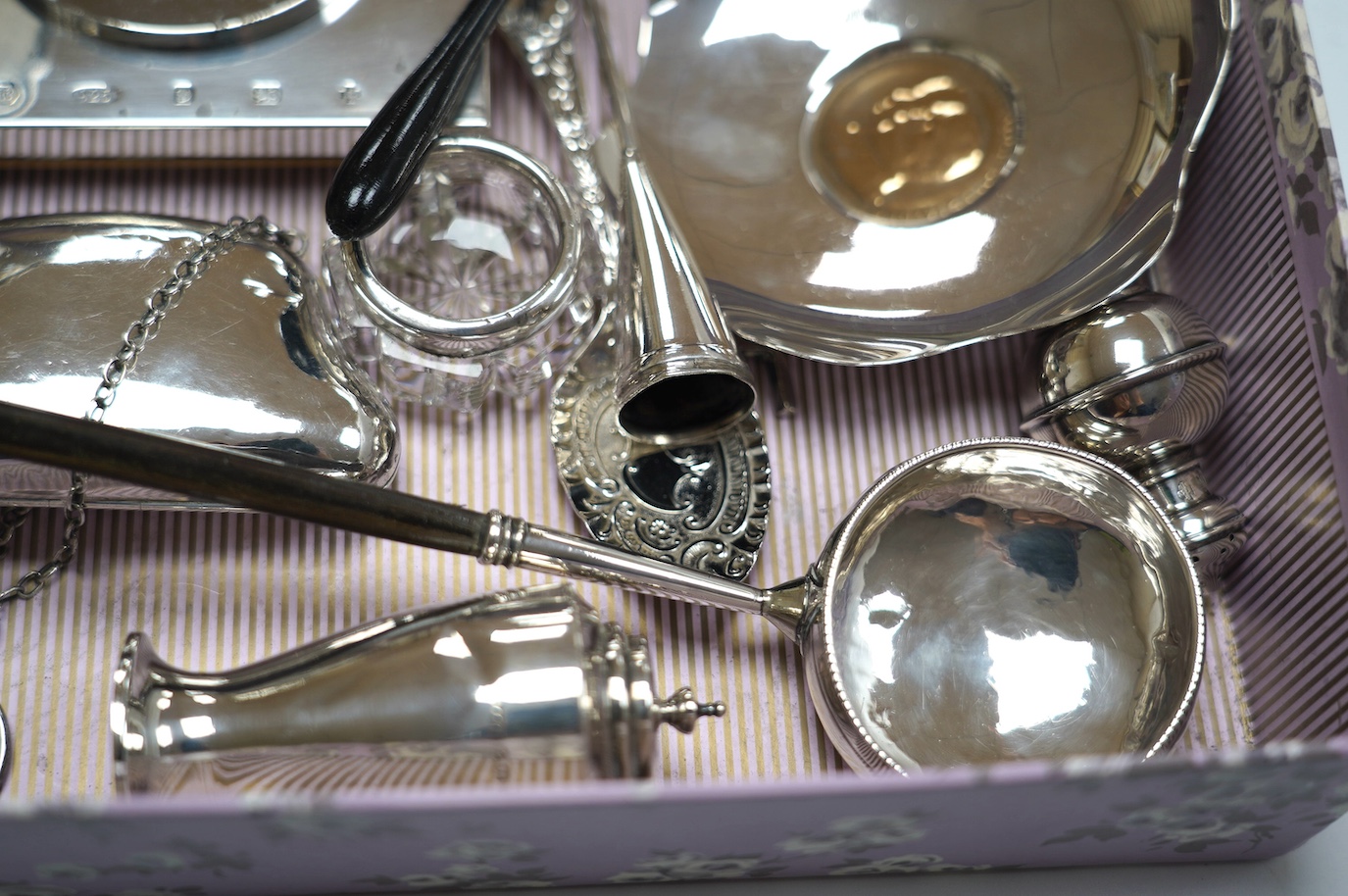 Sundry small silver including a late Victorian silver tea caddy (lid stuck), purse, tazza, modern timepiece, dish with inset coin, extinguisher, toddy ladle etc. and two plated items. Condition - poor to fair to good